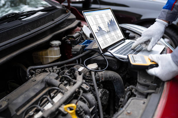 car diagnostic service and electronics repair by mechanic worker